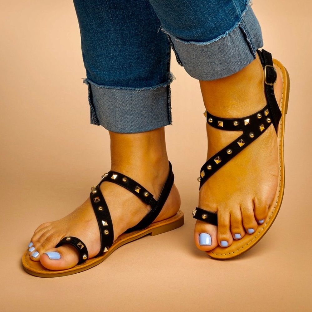 Brand New still in box. Black studded toe ring flats. Size 6.